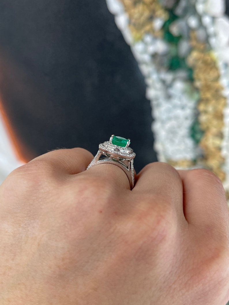 Colombian Emerald 14K white gold engagement ring with round emerald center and double diamond halo.