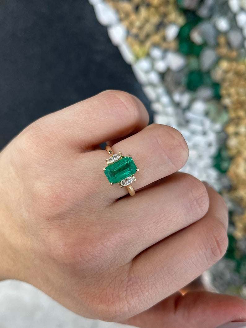 Medium bluish green emerald and marquise cut diamond three-stone engagement ring in 14K gold by Colombian Emerald.