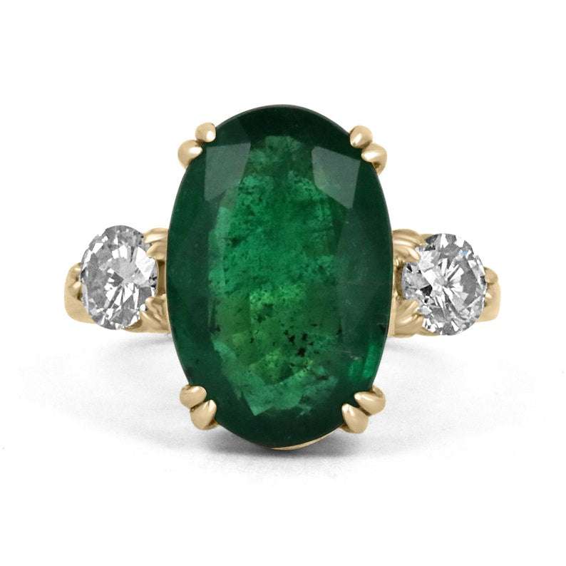 Dark green oval emerald and round diamond 3-stone engagement ring in 14K gold by Colombian Emerald, featuring double prong setting.
