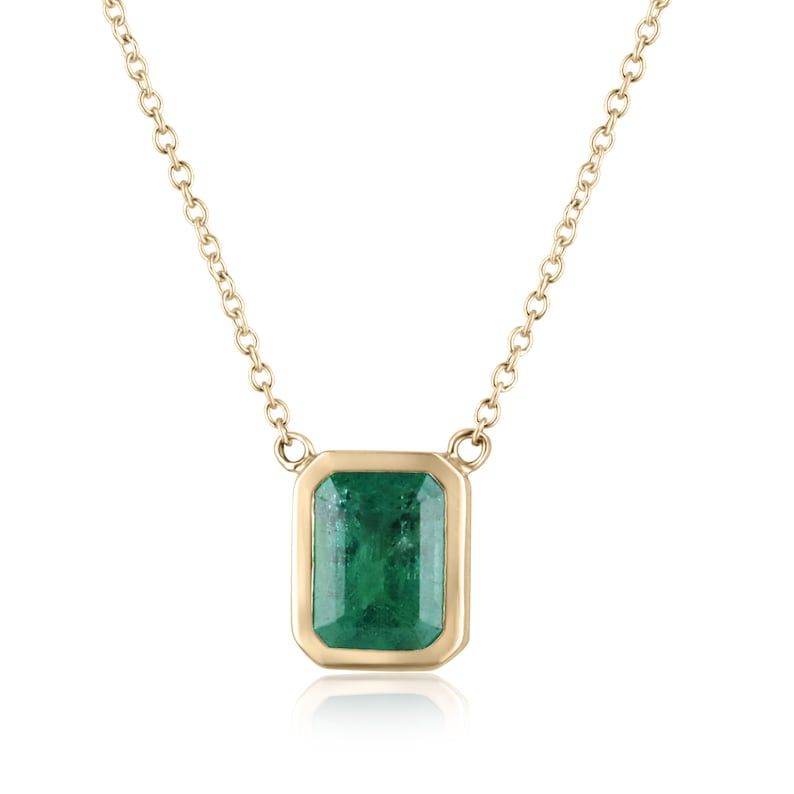 14K gold emerald cut necklace with lush green bezel-set emerald by Colombian Emerald, featuring a stationary, adjustable chain.