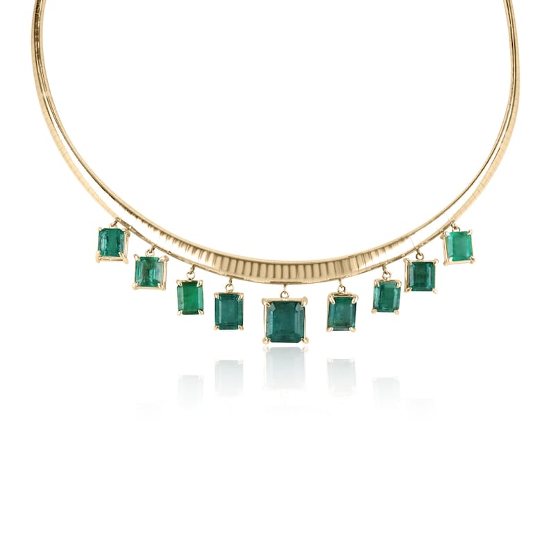 Dark green multi-emerald statement gold omega chain necklace featuring Colombian emeralds, 14K gold, and intricate pendant design.