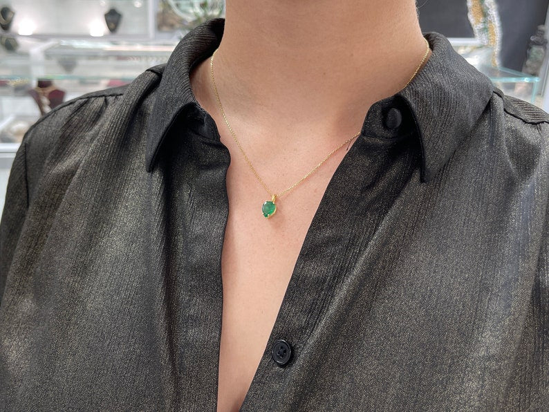 Natural Colombian emerald solitaire pendant with 1.54 carat inverted pear cut in 14K gold setting
