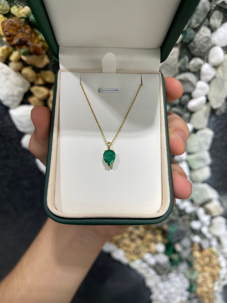 Natural Colombian emerald pendant with 1.54 carat inverted pear cut in 14K gold, showcasing elegant solitaire design.