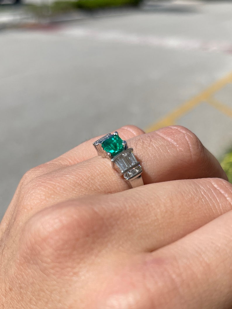 Vivid dark green emerald Asscher cut engagement ring with diamond accents in platinum, by Colombian Emerald.