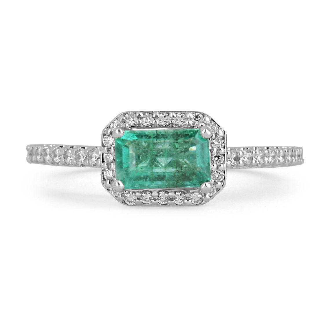 14K gold East-to-West emerald cut engagement ring with diamond halo, featuring 1.25tcw Colombian emeralds and diamonds.