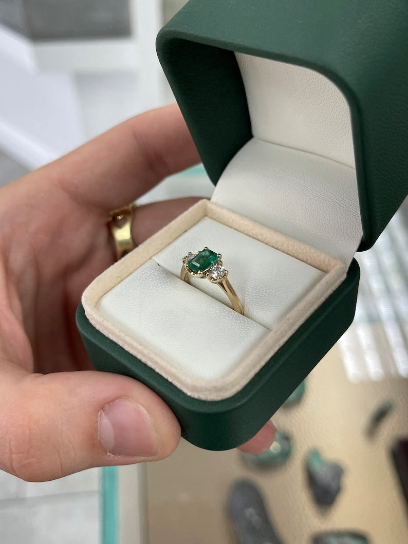 Dark bluish-green emerald and round diamonds 3-stone engagement ring in 14K gold by Colombian Emerald, detailed close-up image.