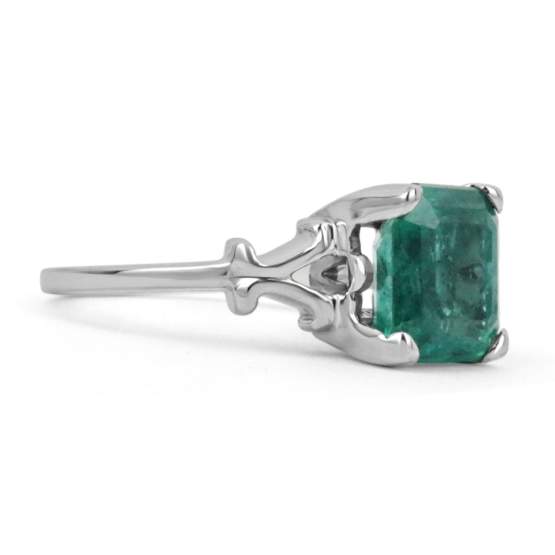 14K white gold engagement ring with a 3.25ct rare blue-green emerald Asscher cut center stone and vintage scroll design.