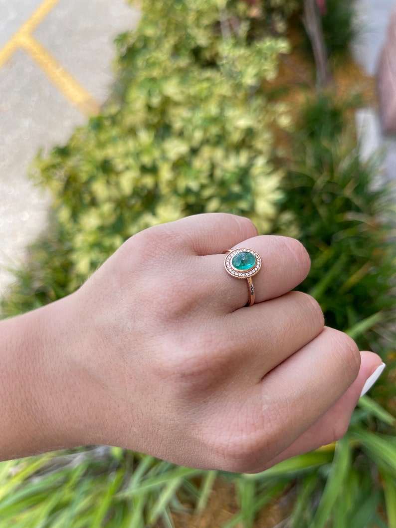 Colombian emerald oval cabochon ring with diamond pave halo, contemporary design, ladies emerald jewelry.