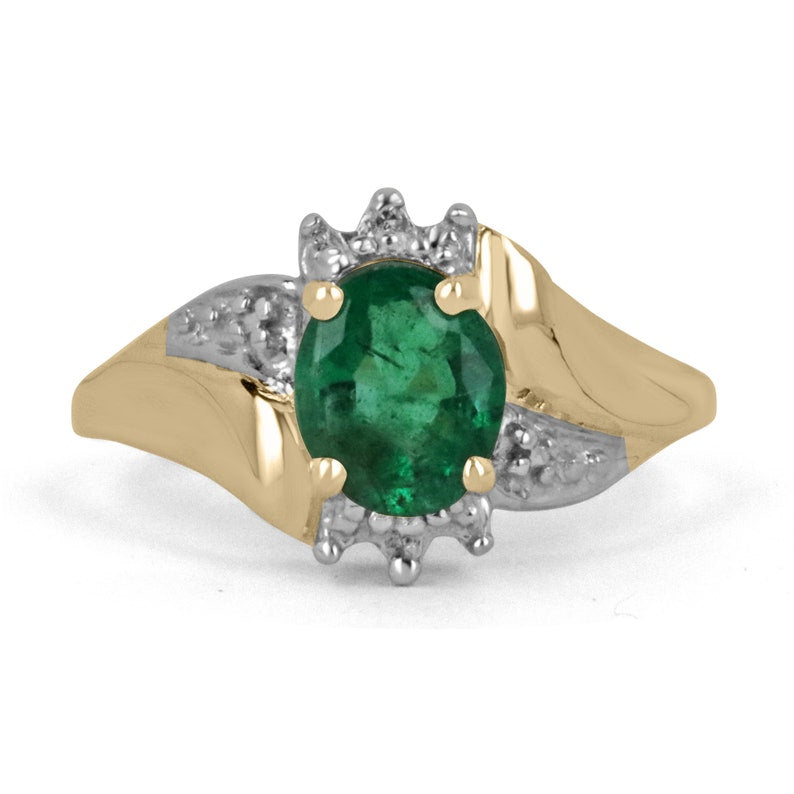 Ladies emerald ring featuring a 1.81tcw dark green oval cut emerald with diamond accents in a 14K gold setting.