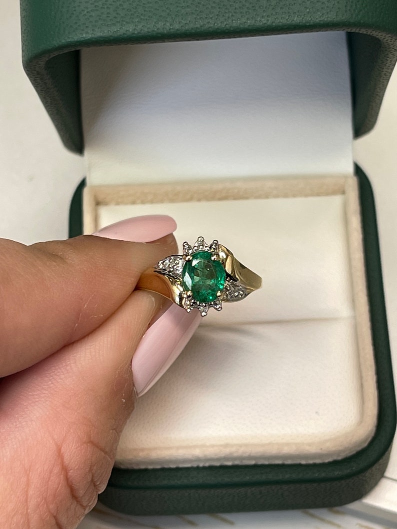 Ladies emerald ring featuring a 1.81tcw dark green oval cut emerald with diamond accents in 14K gold, Colombian Emerald brand