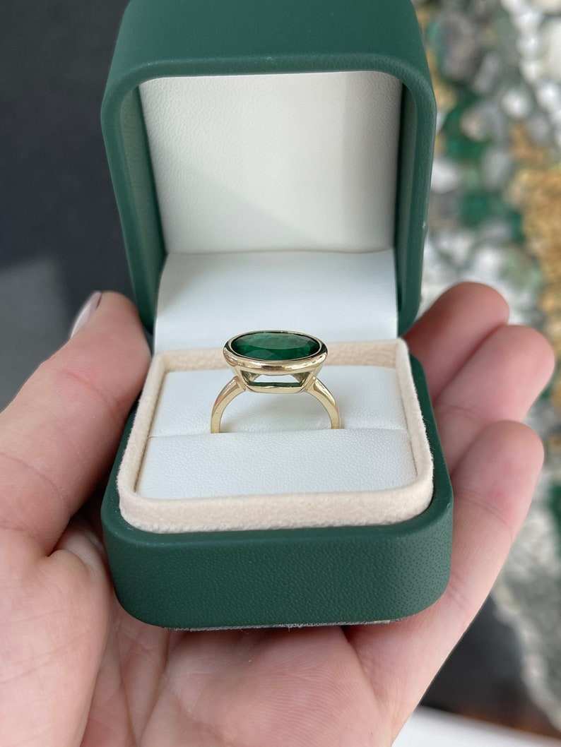 Oval Cut Emerald Solitaire Ring