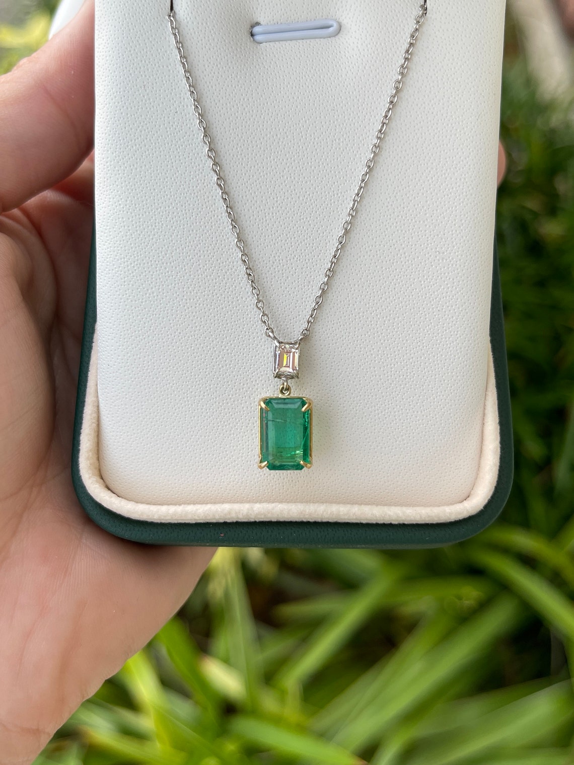 Genuine dark green emerald cut diamond necklace with two-toned gold chain from Colombian Emerald brand.