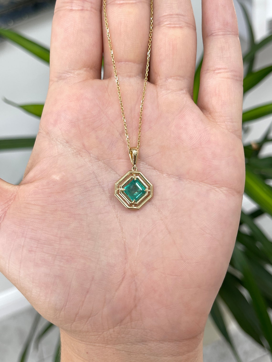14K gold unisex pendant featuring a 2.30ct natural emerald Asscher cut gemstone in a geometric design.
