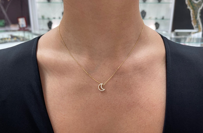 Natural 0.20tcw diamond open moon crescent cable chain necklace in 14K gold, featuring a delicate design and Colombian Emerald branding.
