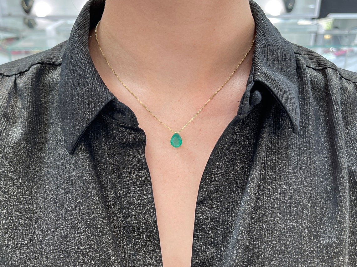 Natural Colombian emerald pendant with a 4.67ct pear-shaped emerald set in a 14K solitaire three-prong necklace.