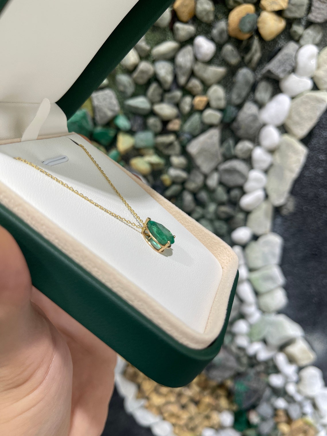 Natural emerald pendant with 4.67 carats pear-cut emerald in a three-prong 14K setting, Colombian Emerald brand.