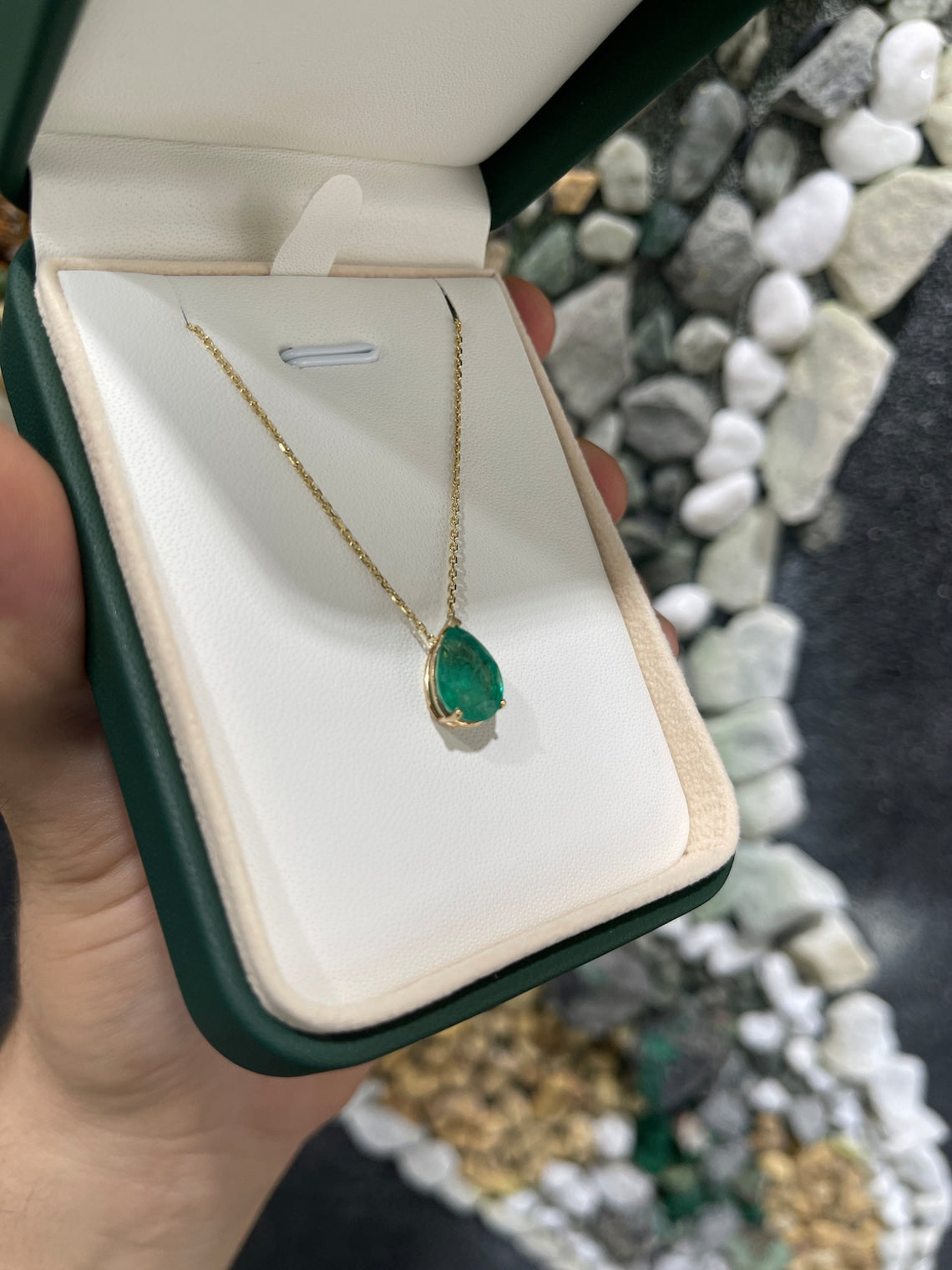 Natural Colombian emerald pendant with a 4.67-carat pear-shaped solitaire in a 14K setting on a chain.