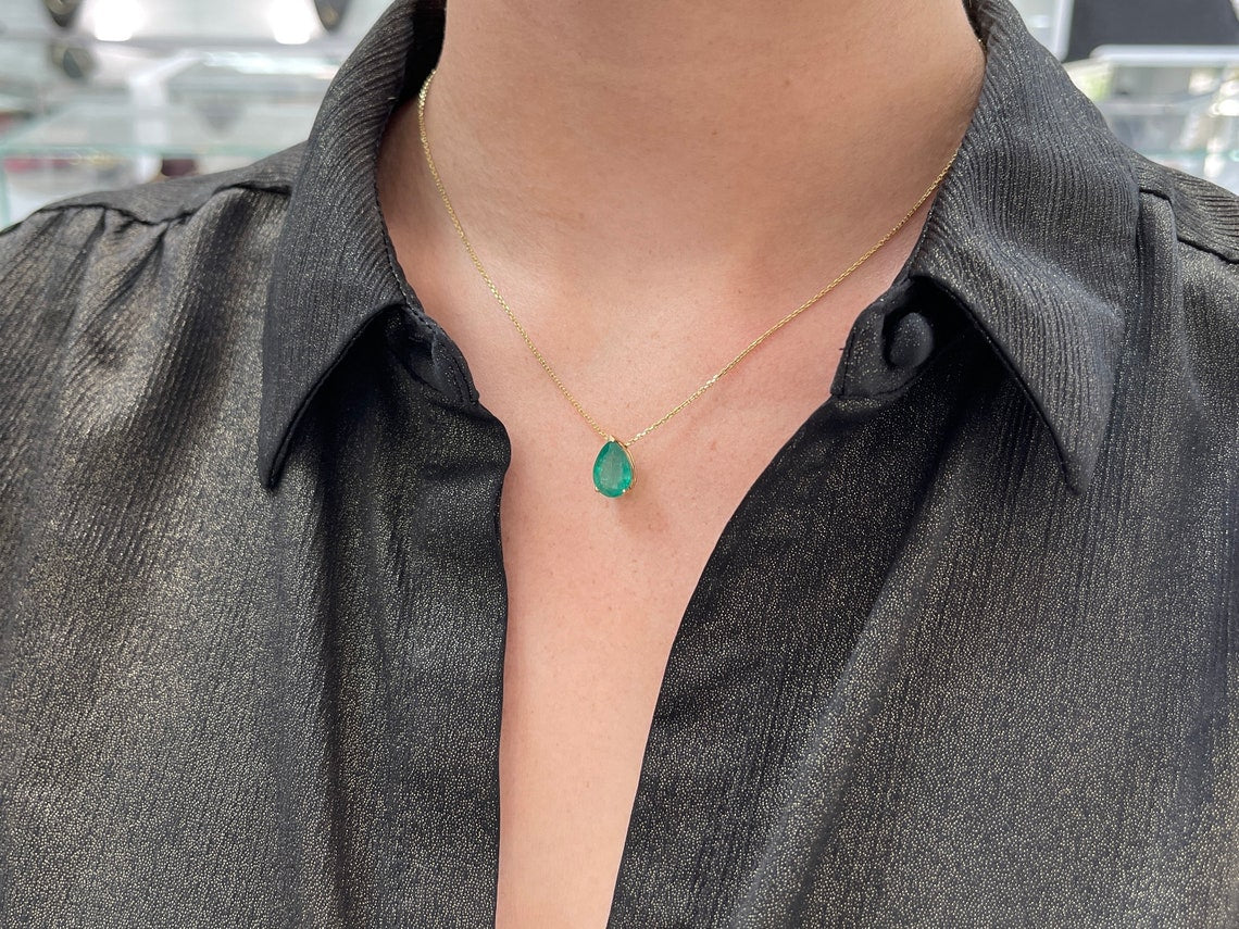 Natural emerald pendant with a 4.67-carat pear-cut emerald in a 14K three-prong setting, from Colombian Emerald.