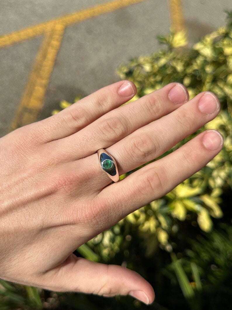 Sterling silver unisex pinky ring featuring a 0.60ct round cut emerald solitaire, Colombian Emerald brand jewelry.