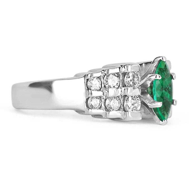 Colombian Emerald and diamond marquise cocktail ring in platinum, semi-transparent design with 0.88 carats total weight.