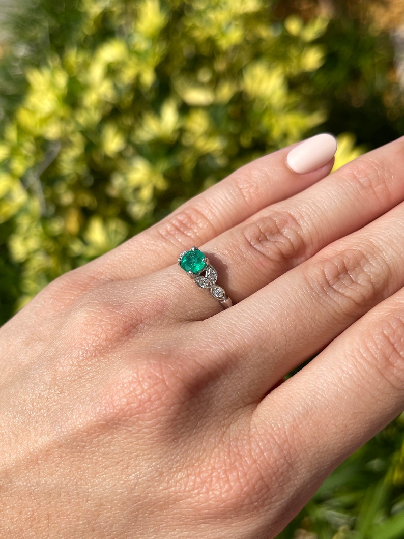 14K gold floral ring featuring 0.96tcw Zambian emerald and round cut diamonds, crafted by Colombian Emerald.