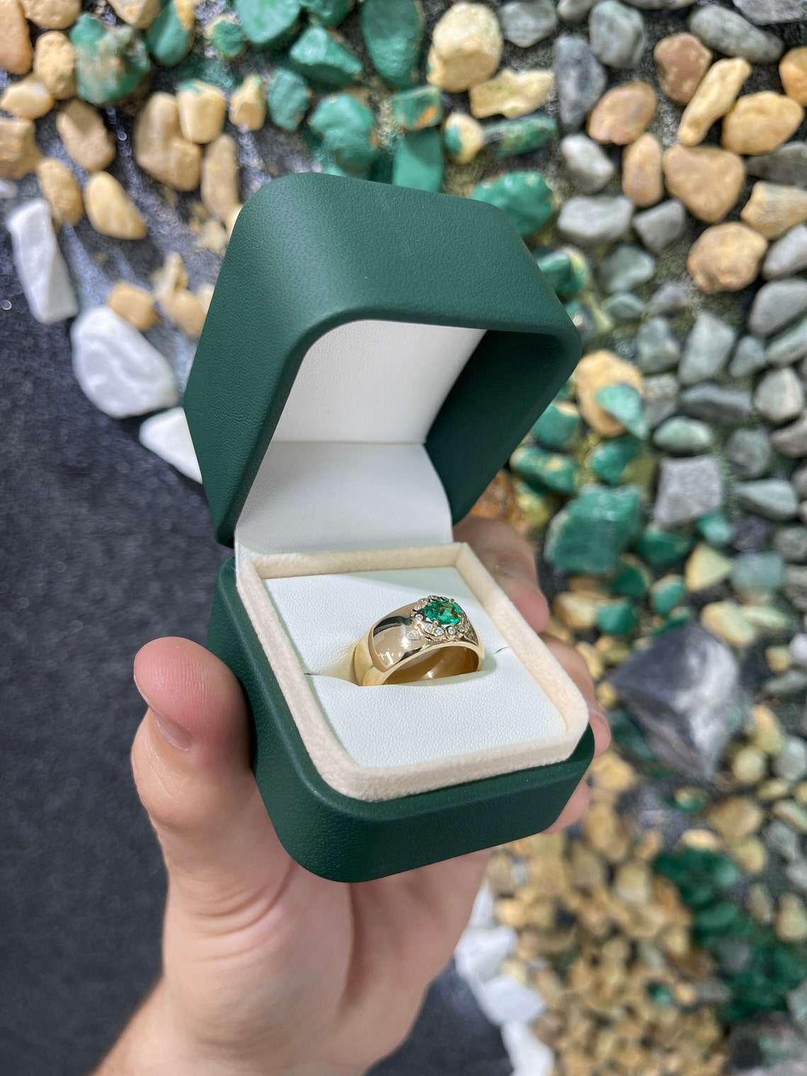 14K Colombian Emerald oval cut ring with diamond halo accent, featuring 1.08tcw emerald and elegant band design.
