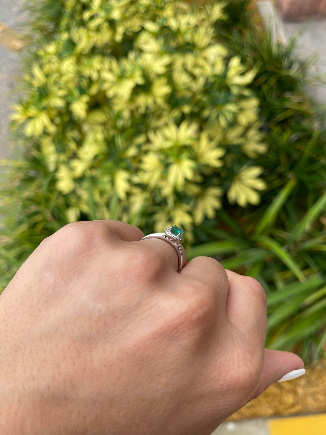 Natural emerald cut engagement ring with diamond halo, 14K gold, from Colombian Emerald, showcasing a stunning 1.21tcw center stone.