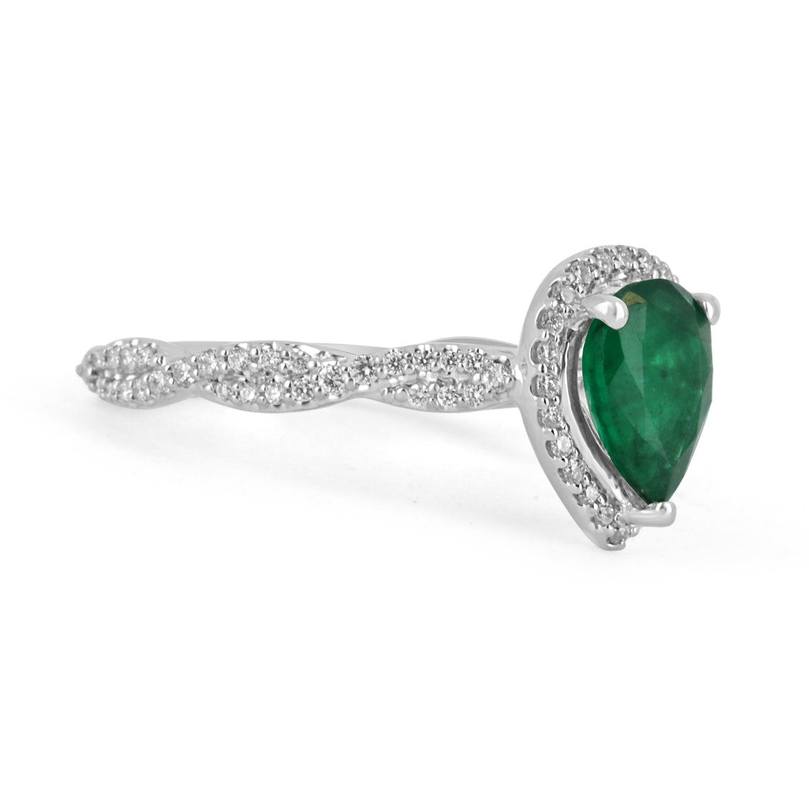 Natural emerald and diamond halo engagement ring in 14K gold featuring a pear-cut emerald, by Colombian Emerald.