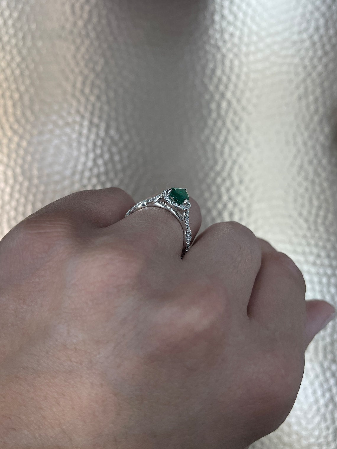 Colombian Emerald engagement ring with 1.30tcw pear-cut natural emerald and diamond halo accents in 14K gold.