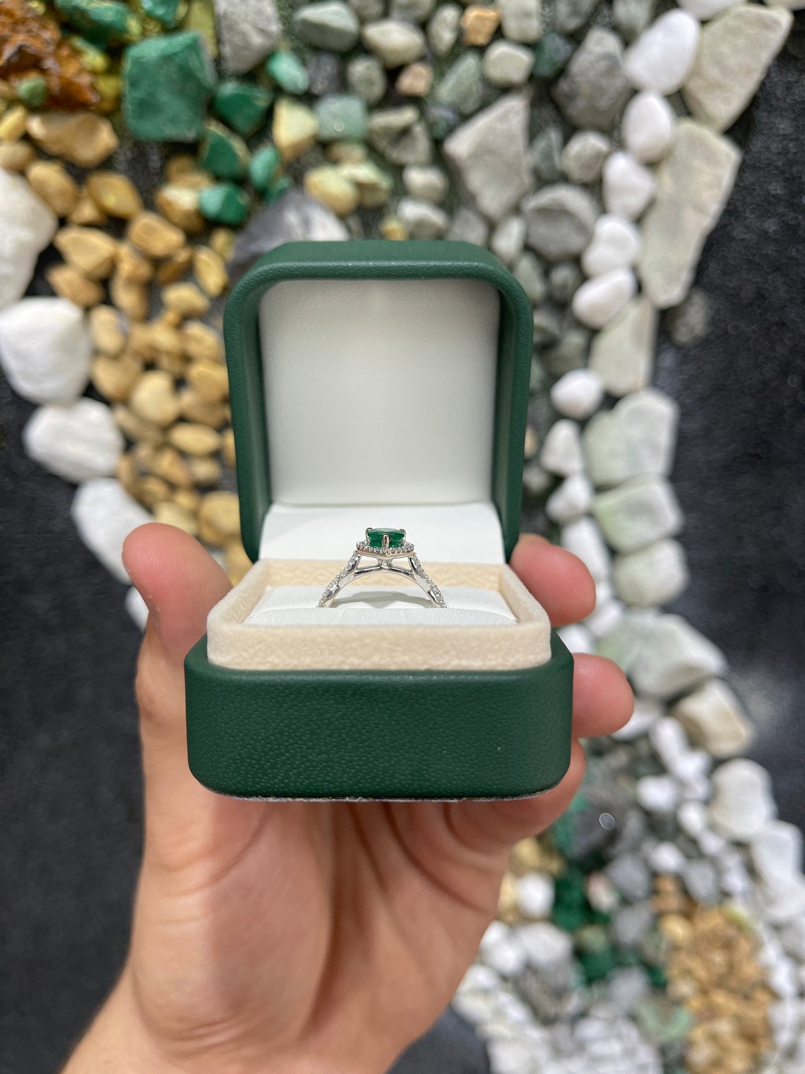 Natural emerald and diamond halo engagement ring in 14K gold with pear-cut emerald, Colombian Emerald brand.