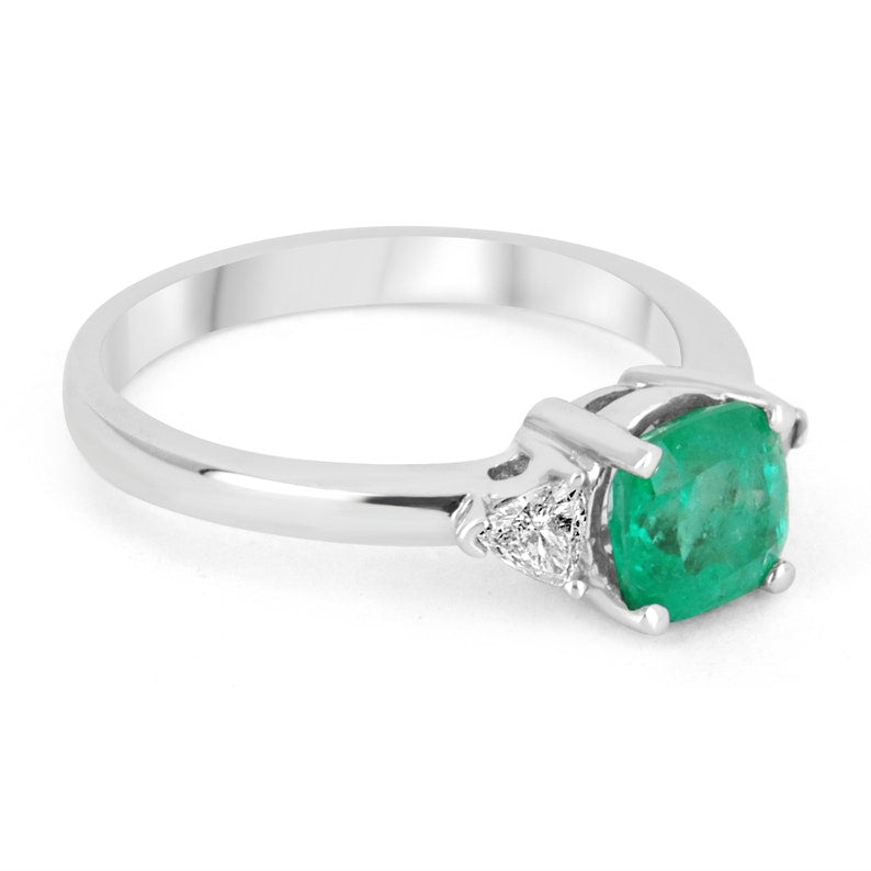 18K Colombian Emerald and diamond three-stone cushion cut ring with 1.48tcw, showcasing vibrant green emeralds and sparkling diamonds.