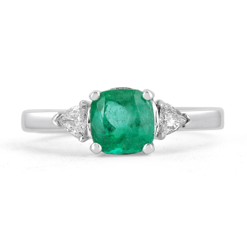 18K Colombian Emerald and diamond three-stone cushion cut ring with 1.48tcw, featuring vibrant green emeralds and sparkling diamonds.