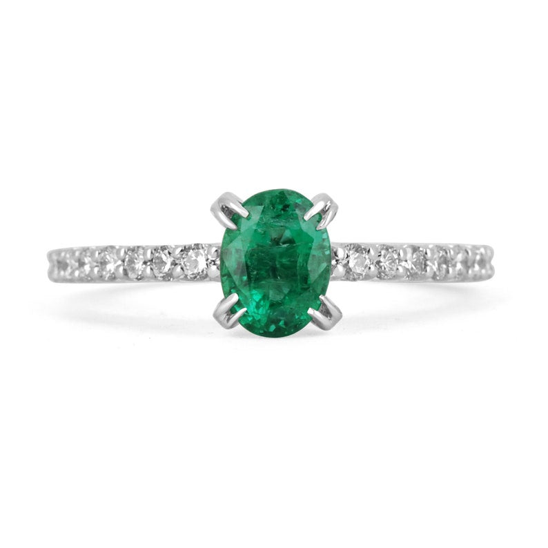 Oval cut natural emerald and diamond engagement ring in 14K white gold from Colombian Emerald, showcasing elegance and sparkle.