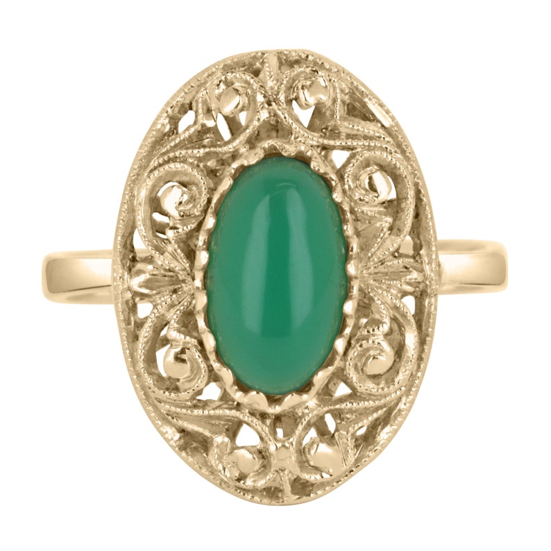 Handmade antique ring featuring a 2.03ct elongated oval Colombian emerald cabochon with floral design in 18K gold.