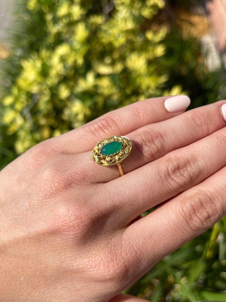 Natural Colombian emerald oval cabochon ring with floral antique design, 18K gold handmade jewelry featuring a 2.03-carat emerald.