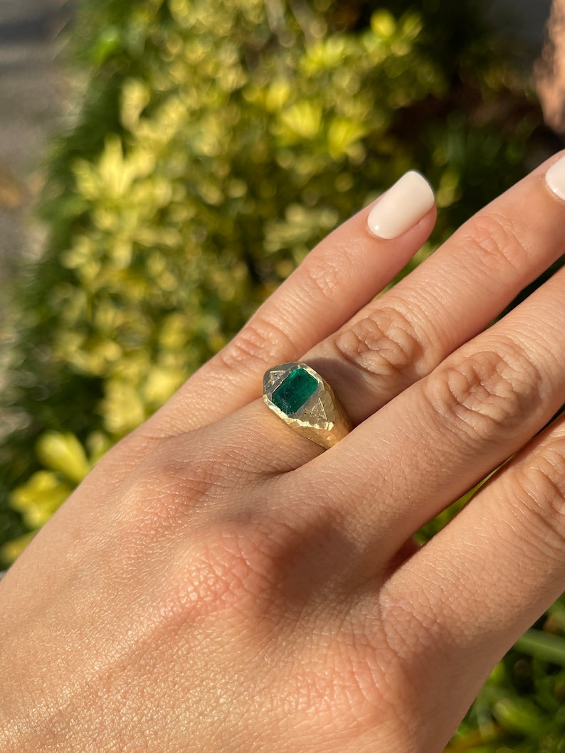14K gold 3-stone emerald and trillion cut diamond gypsy ring with vertical top design, featuring green natural gemstones.