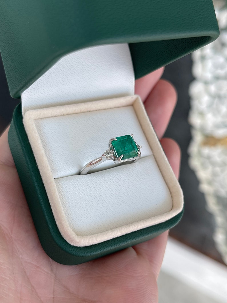 Dark green genuine emerald Asscher cut and diamond 3-stone engagement ring in 14K gold from Colombian Emerald.