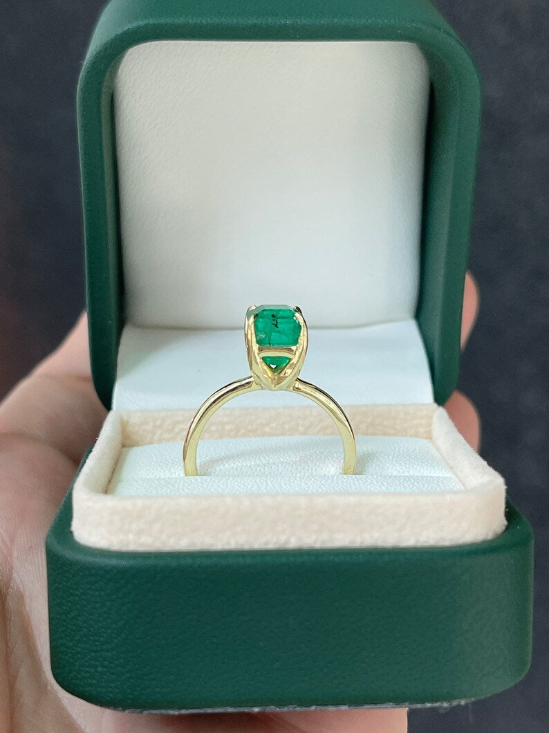 14K gold emerald cut solitaire engagement ring with 2.65ct Colombian Emerald, showcasing a classic, elegant design.