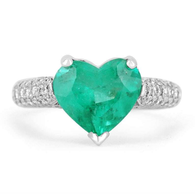 Colombian emerald heart-shaped diamond platinum ring with pave diamonds