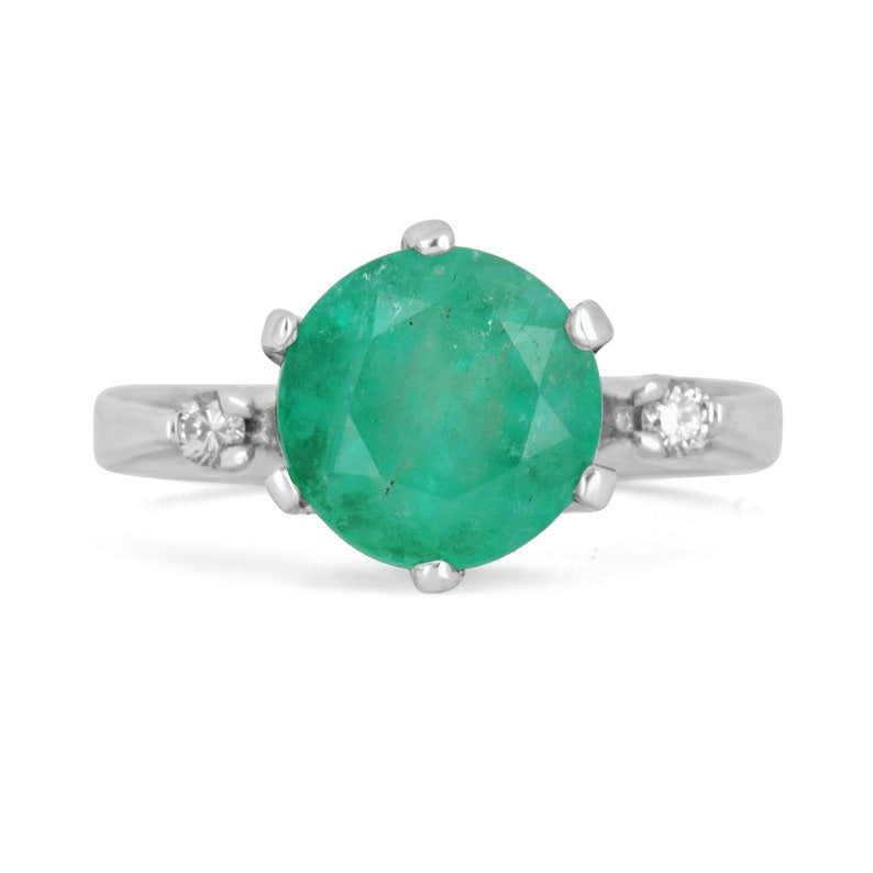14K gold ring with three round cut Colombian emeralds totaling 3.21 carats and diamond accents, showcasing elegant jewelry design.