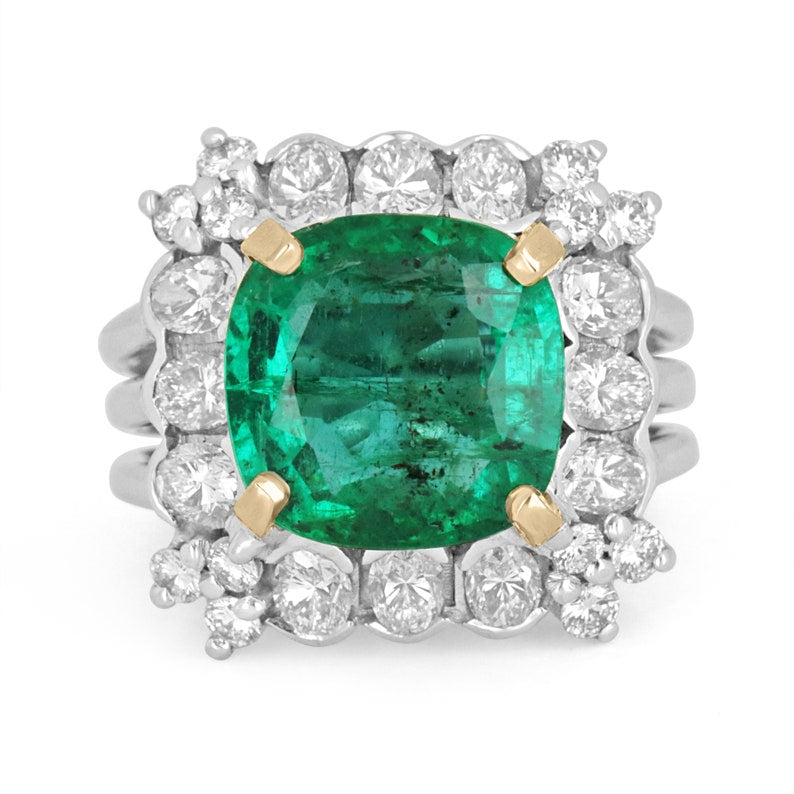 Colombian Emerald 18K gold cocktail ring with cushion-cut emerald and round diamonds, semi-transparent design, elegant jewelry piece.