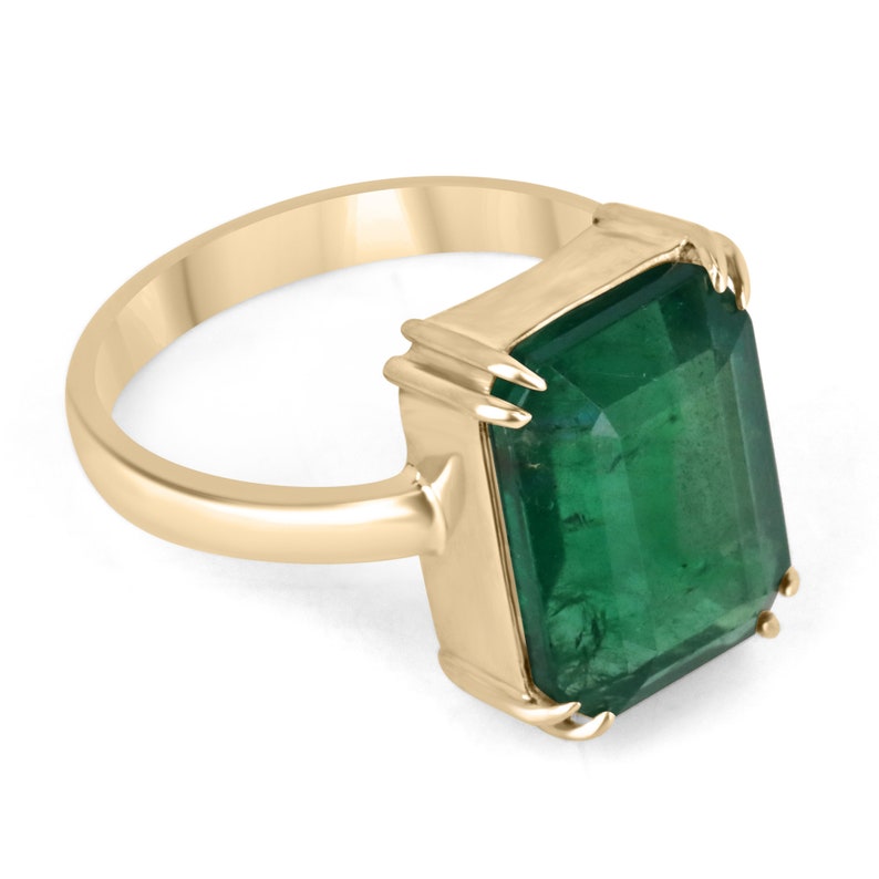 18K gold natural emerald solitaire engagement ring featuring a 7.25-carat emerald gemstone, Colombian Emerald brand.