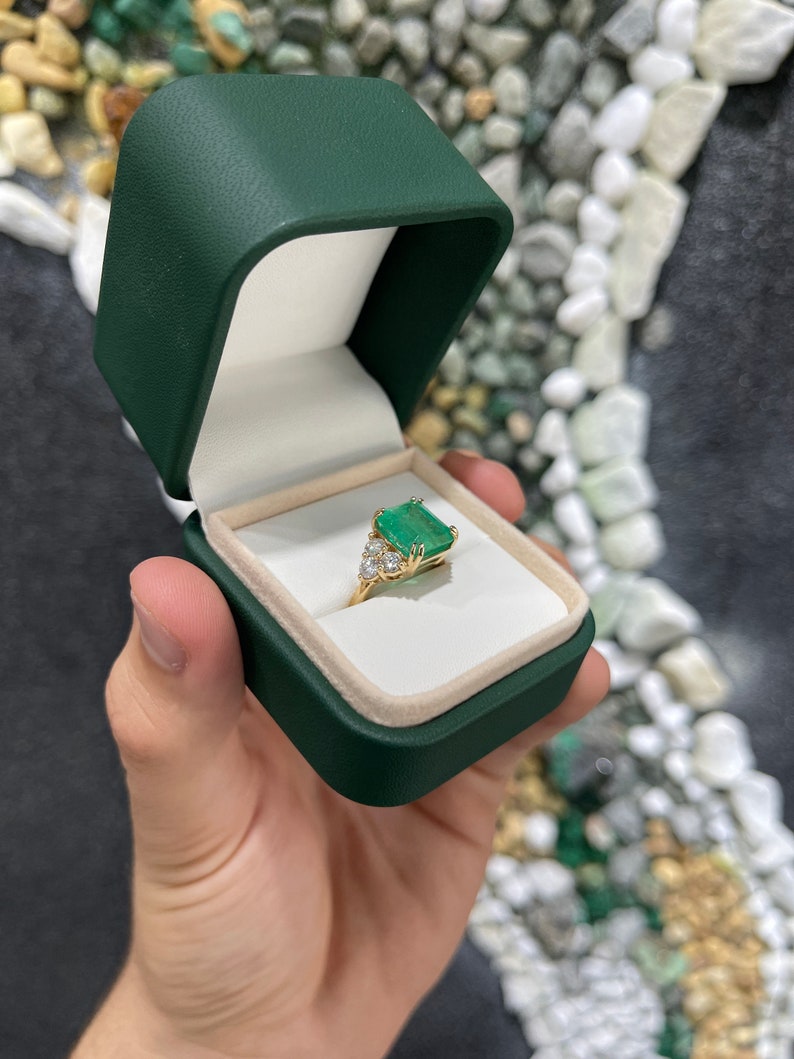 7.61tcw 18K Colombian Emerald & Diamond Accent Three Stone