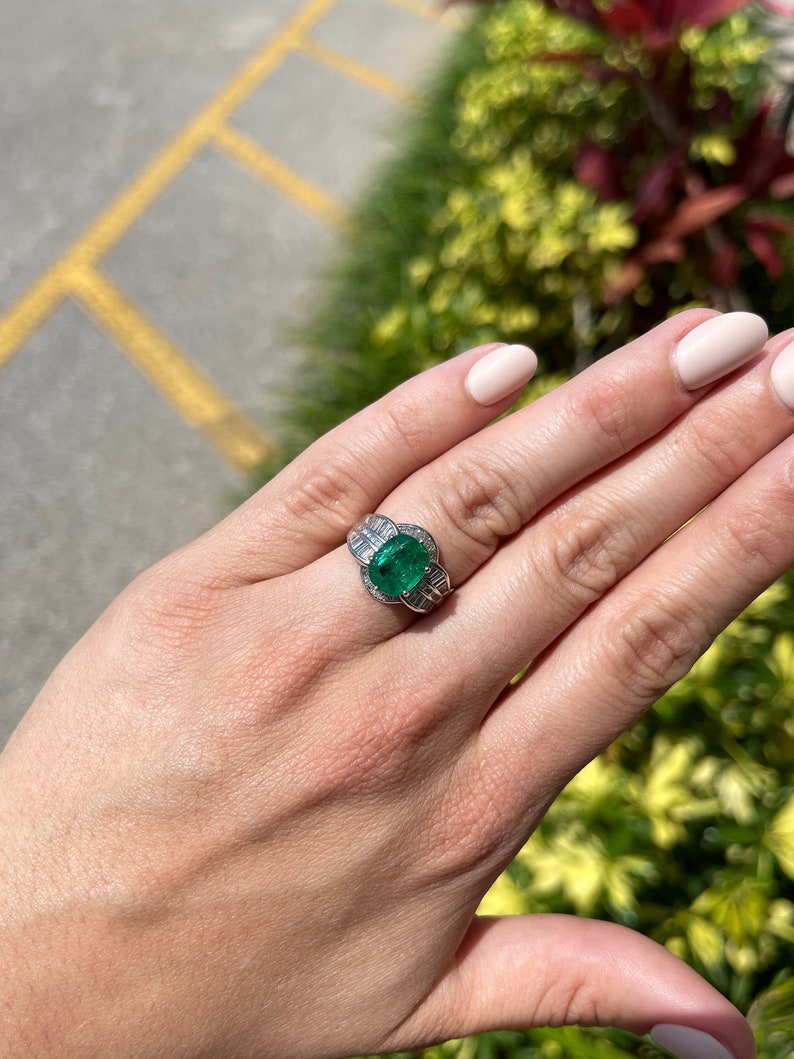 Antique Colombian Emerald and diamond oval cut ring in 18K white gold, showcasing a 3.77 carat natural emerald centerpiece.