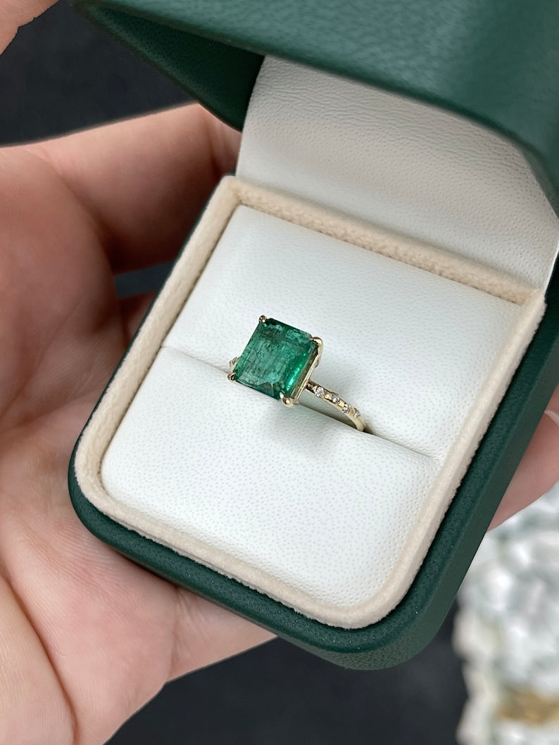 Dark emerald and diamond accent engagement ring featuring 2.68tcw in 14K gold from Colombian Emerald, close-up of the ring's detailed design.