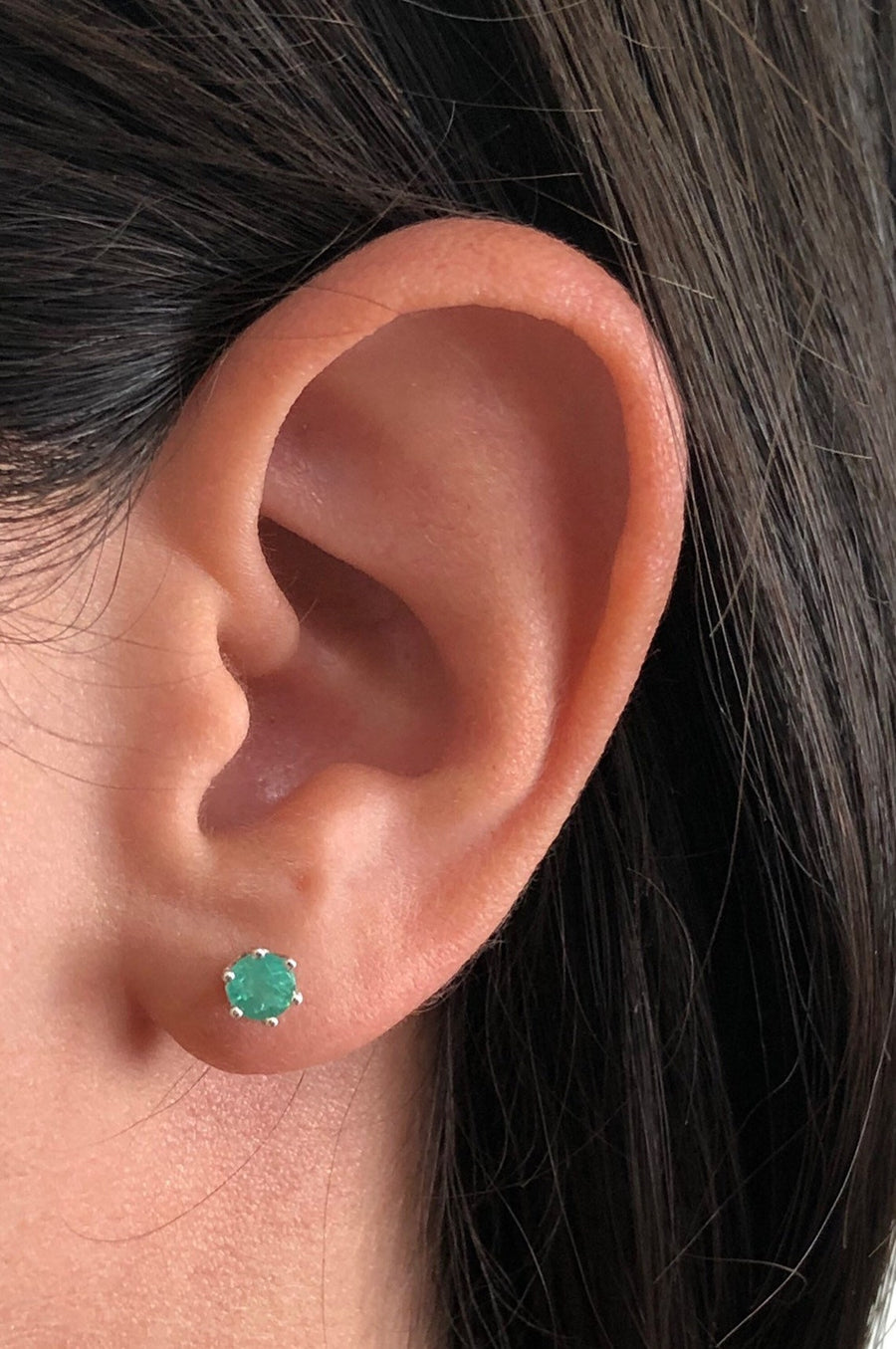 Round Studs 4mm Emerald Earrings on Ear