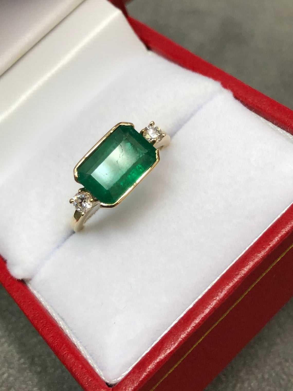 Elegance Unleashed: 2.60tcw East To West Channel Set Natural Emerald & Diamond Three Stone Ring