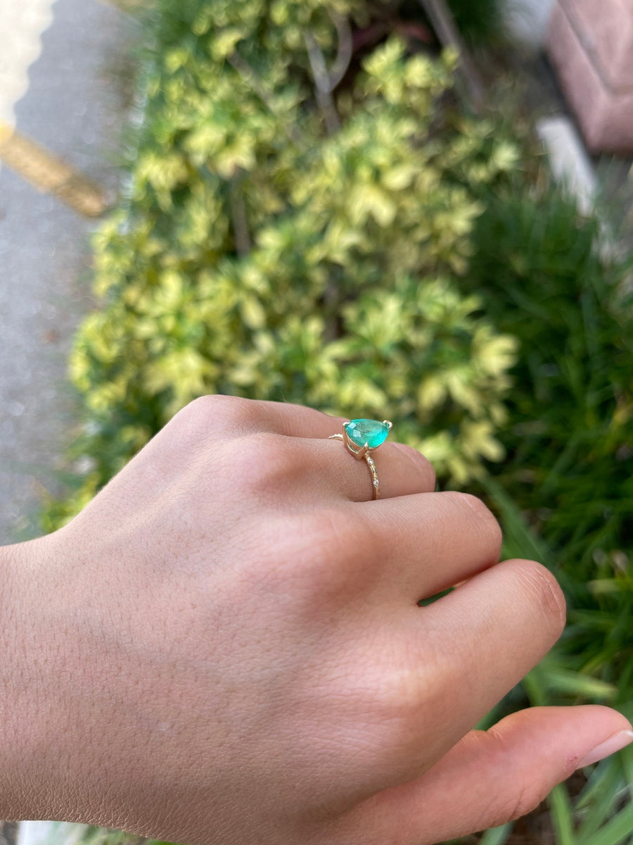Celebrate Brilliance: 14K Gold Ring Featuring 2.24tcw Pear Emerald & Diamond Sprinkled Accent