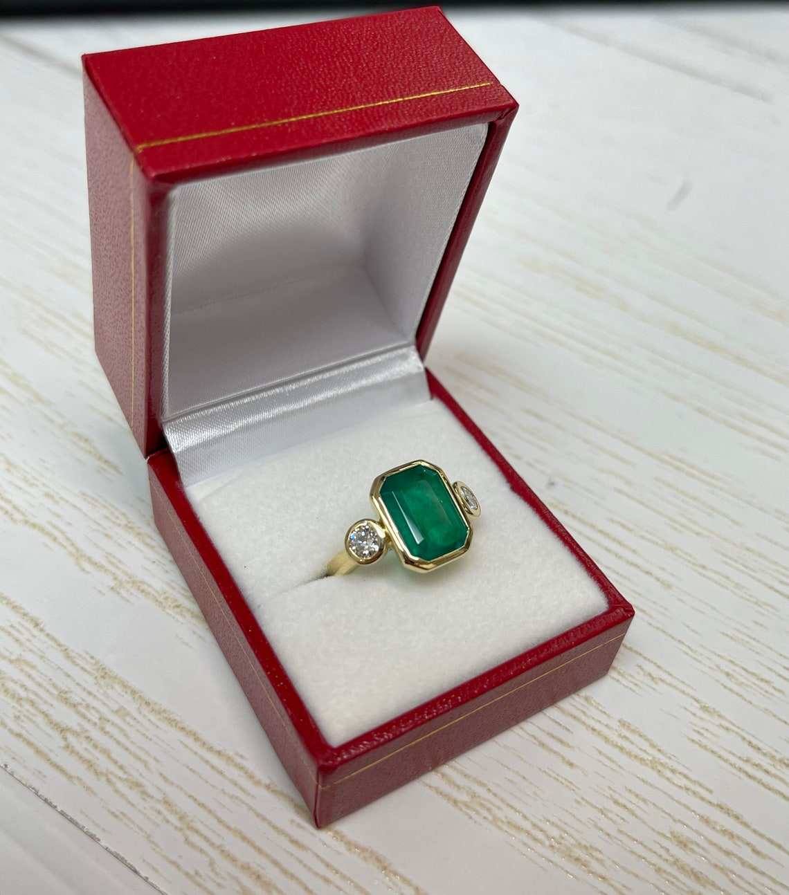 sophisticated 4.16tcw emerald and diamond ring in 18K gold