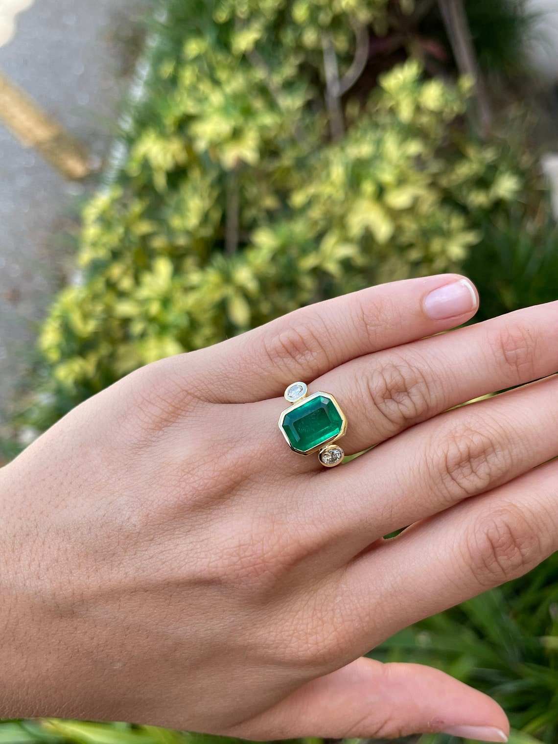 dark green emerald and diamond bezel ring in 18K gold